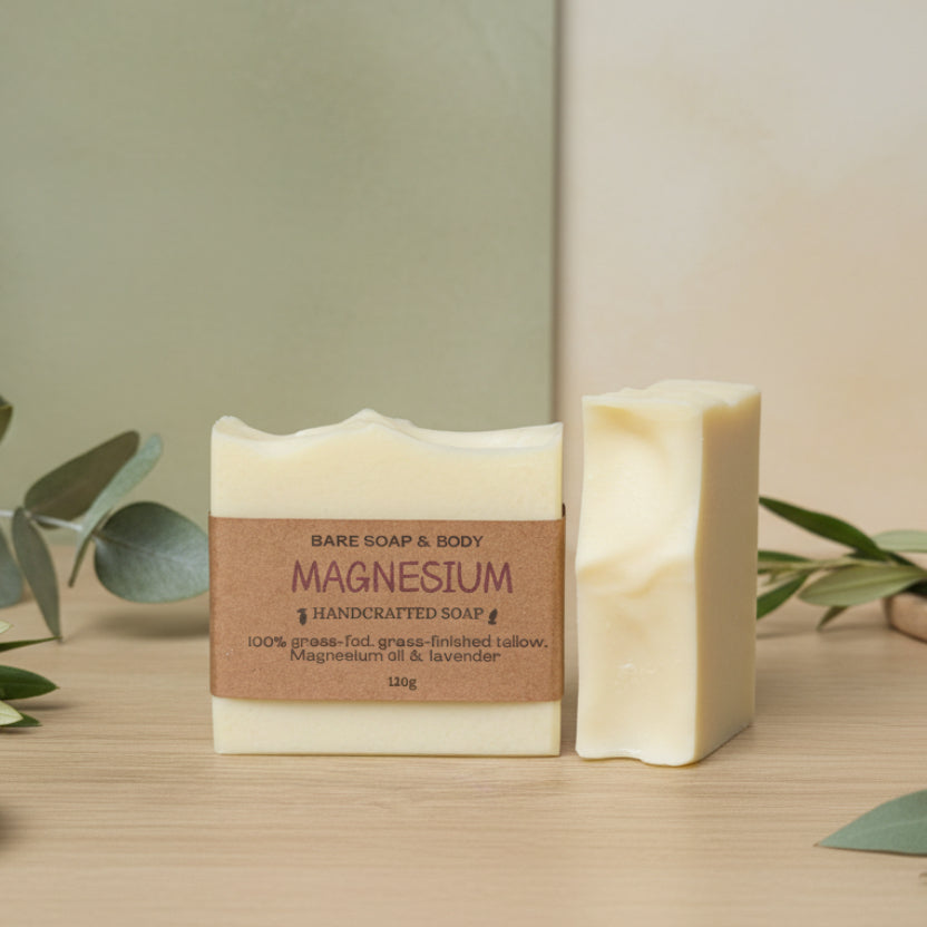 Two bars of soap with a visible label on a wooden surface