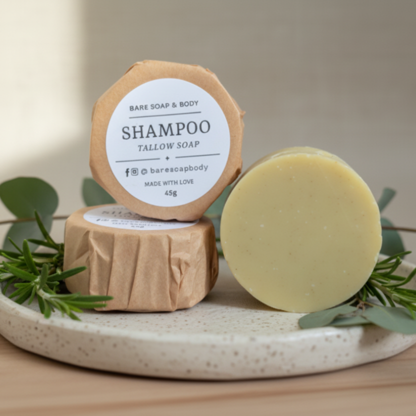 Two tallow soaps with visible branding on a neutral background