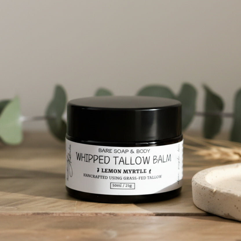 Jar of Bare Soap & Body Whipped Tallow Balm on a wooden surface with a neutral background