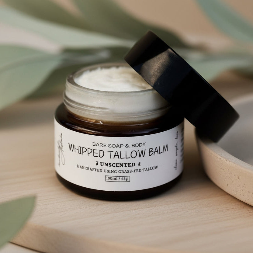 Jar of Whipped Tallow Balm by Bare Soap & Body on a wooden surface