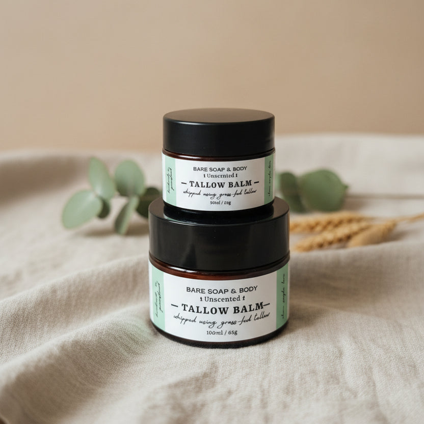 Two jars of Bare Soap & Body Unscented Tallow Balm stacked on top of each other, placed on a woven brown surface against a woven beige background.